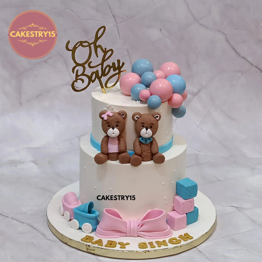 2kg two-tier black forest welcome baby cake with teddies, prams, faux balls and Oh Baby topper by Cakestry15 Noida.
