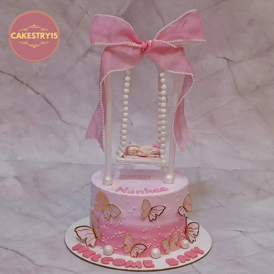 Eggless kids birthday cake with welcome baby theme cake Noida design, black forest flavour with personalised name Nanhee