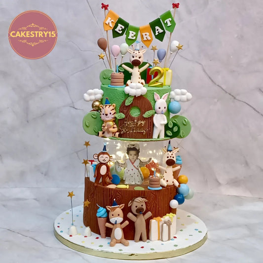 Wild jungle safari kids birthday cake in Noida with fondant animals, spacer design and chocolate flavour, handcrafted as premium eggless cakes for second birthday celebrations.